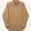 A tan long-sleeve button-up shirt with a subtle all-over micro-dot pattern, featuring two chest pockets and buttoned cuffs, shown flat against a light cream background.