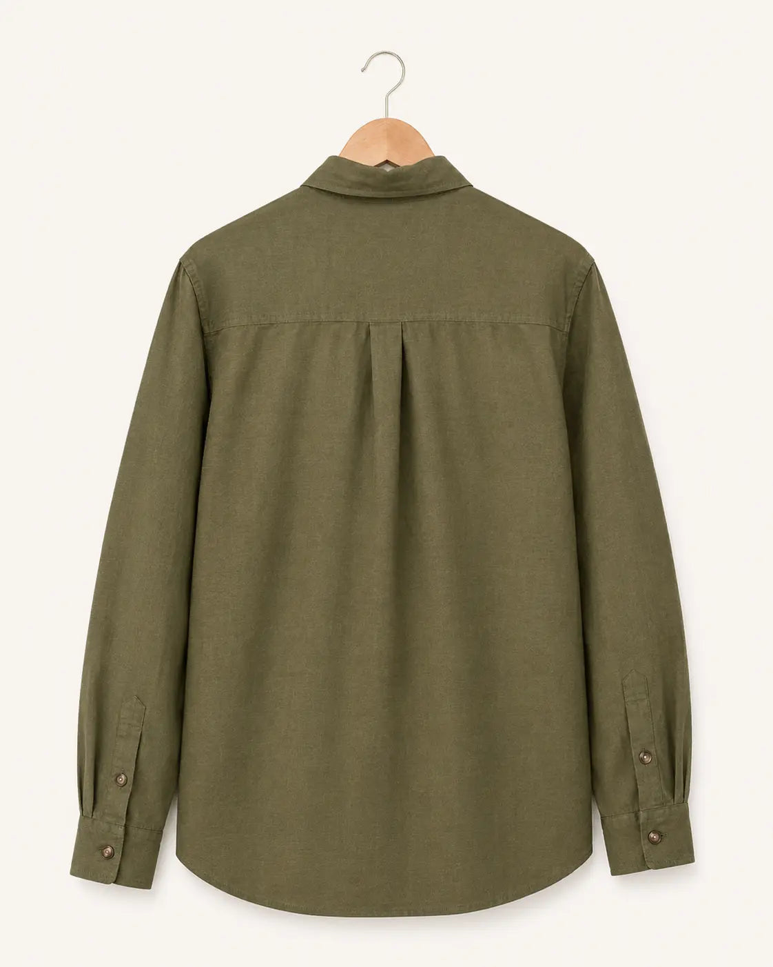 An olive green long-sleeve button-up shirt shown from the back, hanging on a wooden hanger against a light beige background.